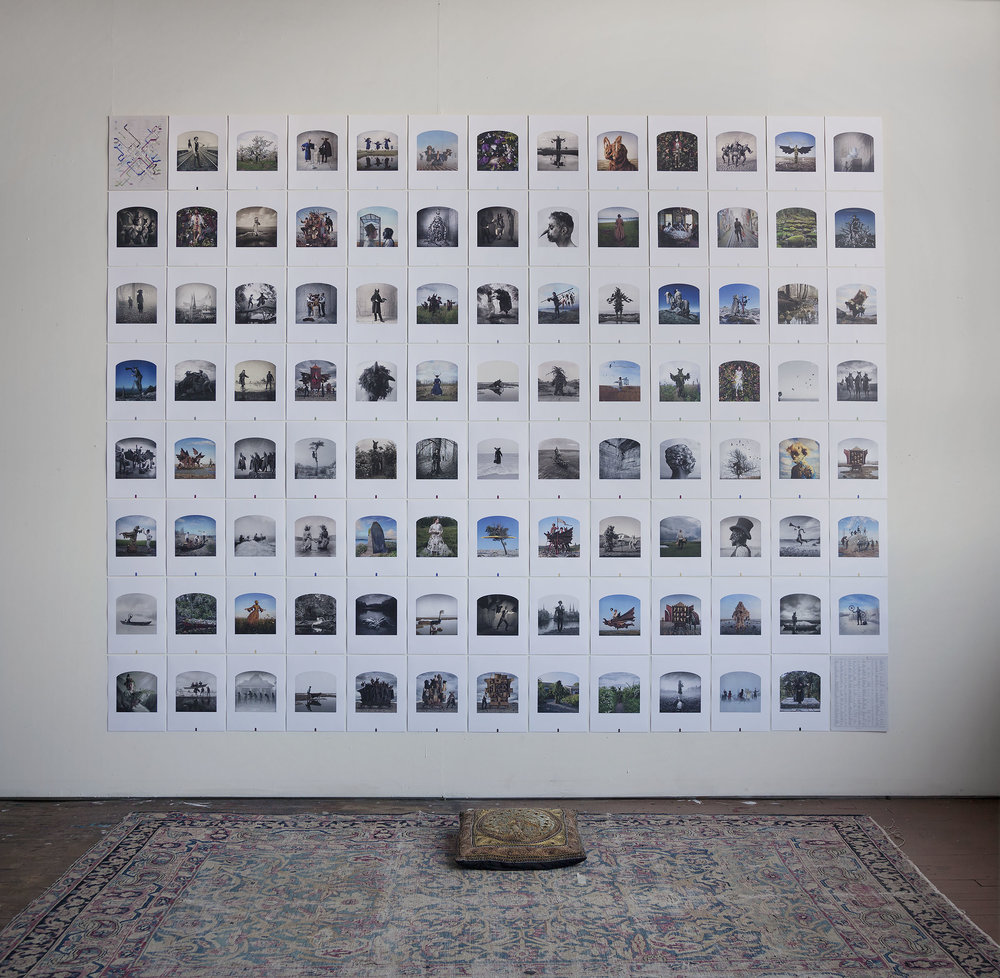 Image of all of the prints from the book hung on a wall